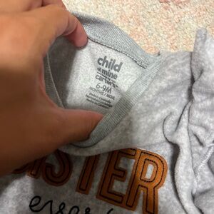 6-9 months. Child of mine, Carter’s brand. Long sleeve sweater.